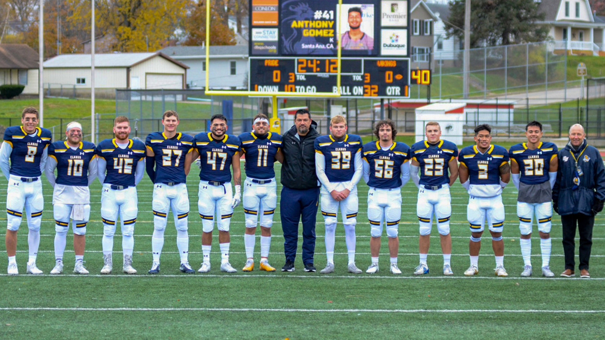 Pride seniors pose with head coach Miguel Regalado and athletic director Curt Long