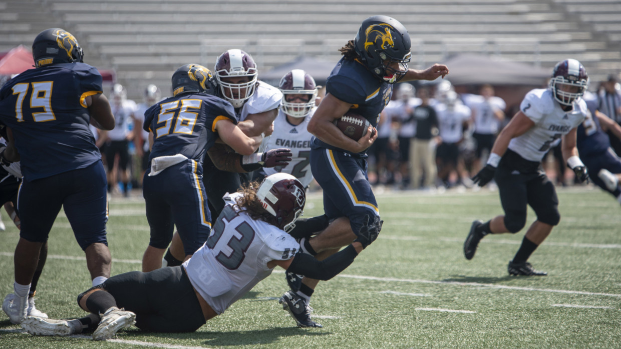 Pride running back Craig Elmore slipping out of a tackle
