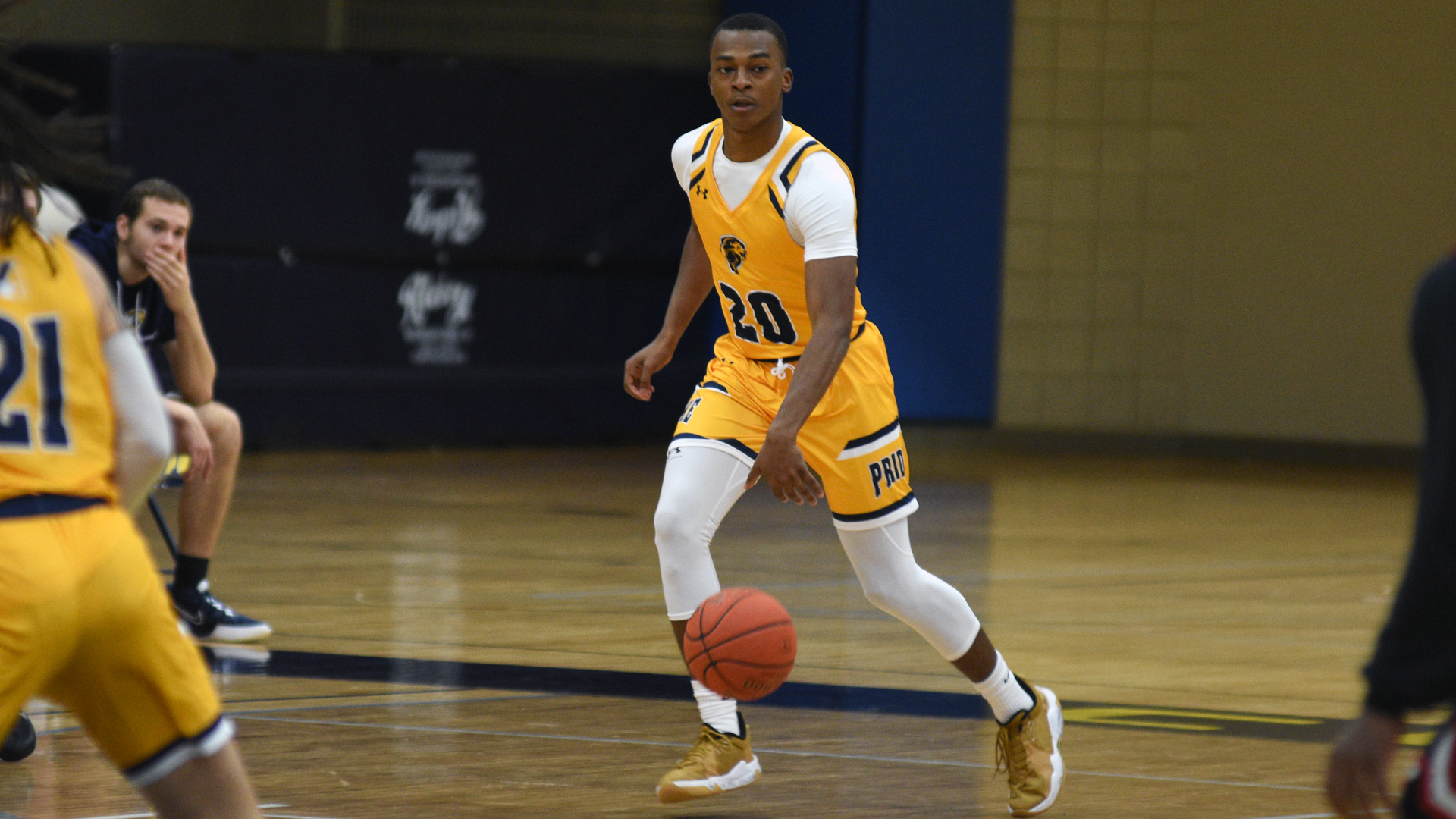 Clarke's Daquon Lewis dribbling up the floor