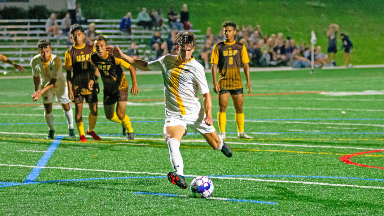 CU's Luke Persenico approaching a penalty kick attempt
