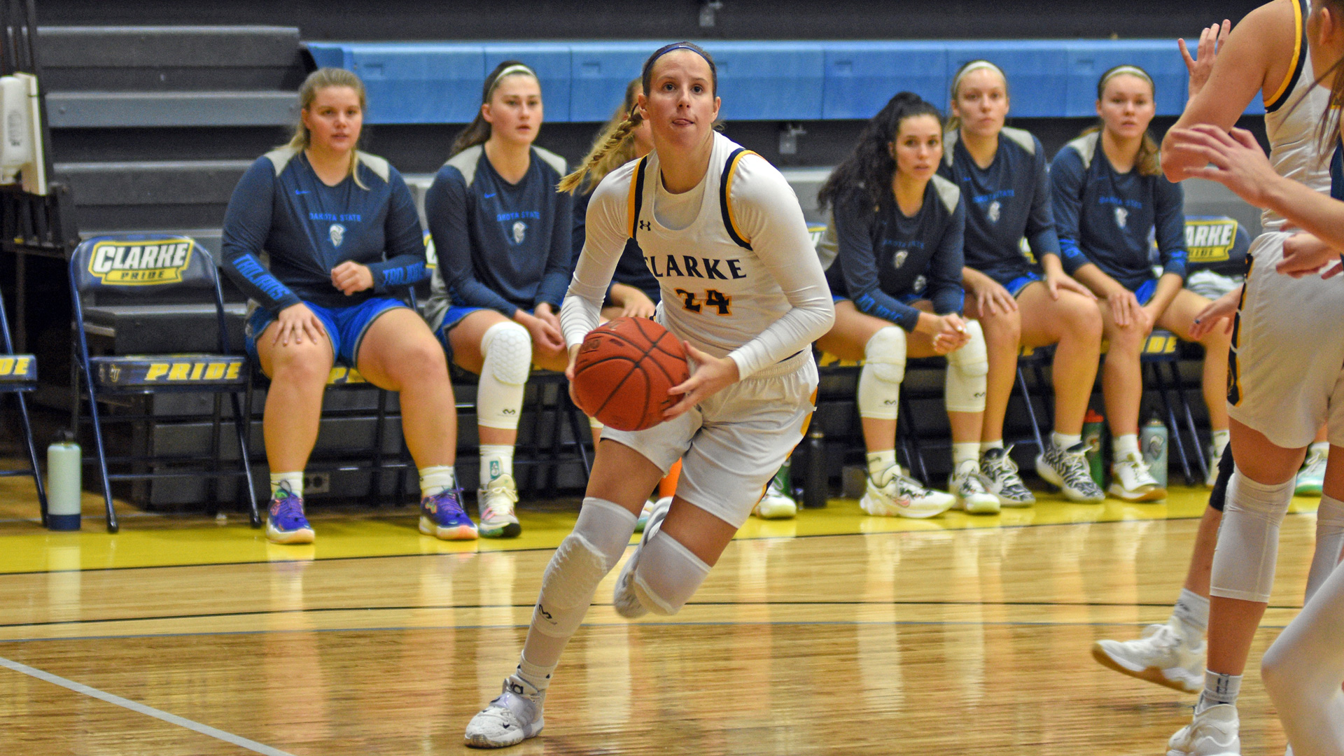 Clarke's Mya Merschman driving towards the basket