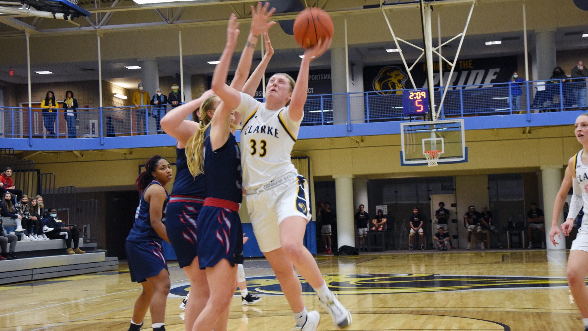 Clarke's Tina Ubl goes up for a shot against challenging defenders
